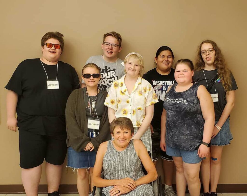 Vicki posing with students from the Summer Transition program at the Rehab Center for the Blind.