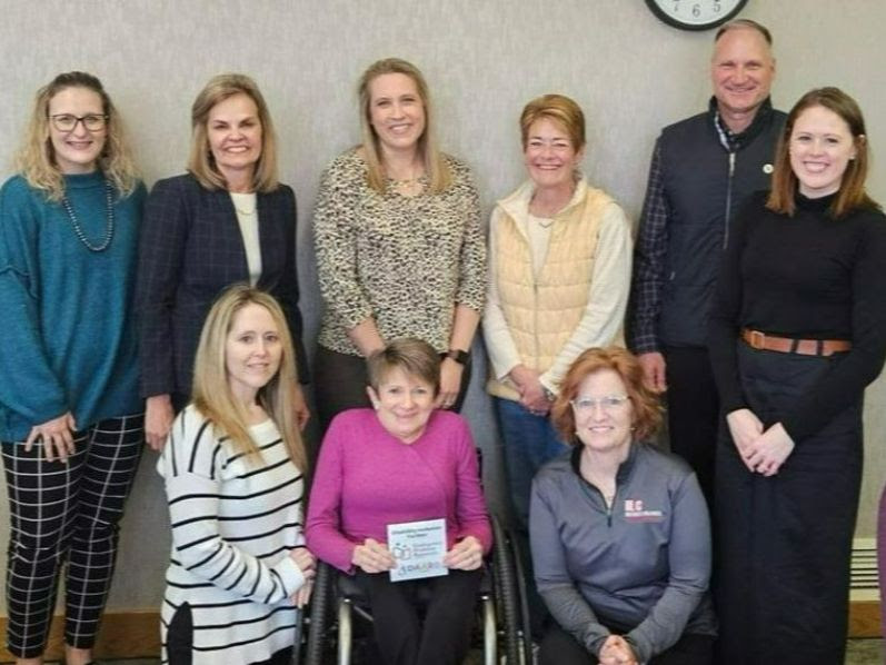 Vicki Stewart with Sioux Empire United Way staff: Jill Chedester, Administrative Associate; Pam Hanneman, Interim CEO/President; and Christina Riss, Chief Operations Officer; Sioux Empire United Way Executive Board: Adrienne McKeown, Brenda Kibbe, Randy Knecht and Kate Kotzea; and Cathleen Zepeda from the Disability Awareness and Accessibility Review Board.